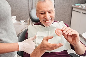 A man getting dentures made